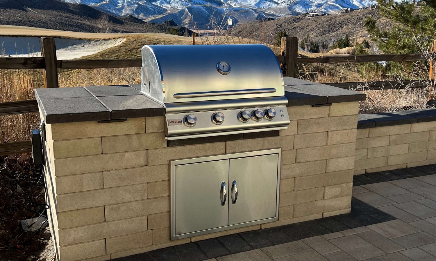 Built-in stone barbecue island in a Northern Nevada backyard